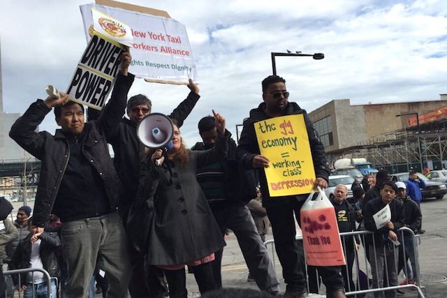 Uber drivers protesting outside of the Uber offices in Long Island City on Monday